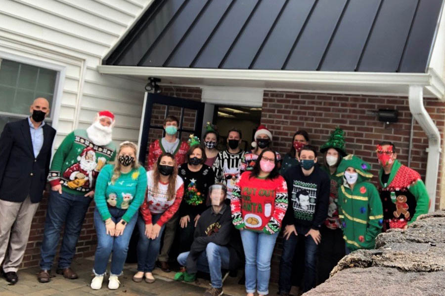 About Our Agency - The Satanoff Agency Team Photo outside the Office in Christmas Attire